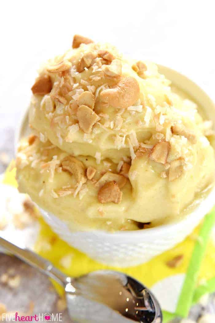 Close-up of Banana Ice Cream topped with cashews and toasted coconut