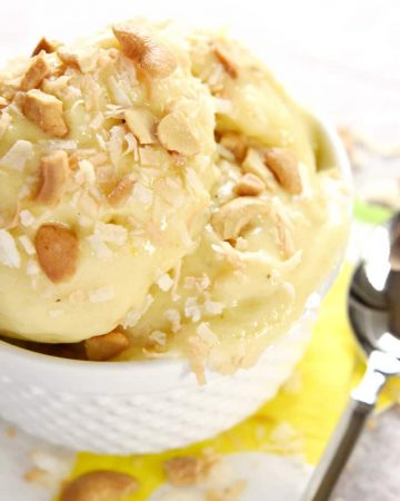 Tropical Banana "Ice Cream" ~ features frozen bananas, pineapple, and mango whipped to an ice cream-like consistency for an all-natural, all-fruit treat with no added sugar...decadent enough for dessert yet healthy enough for breakfast! | FiveHeartHome.com
