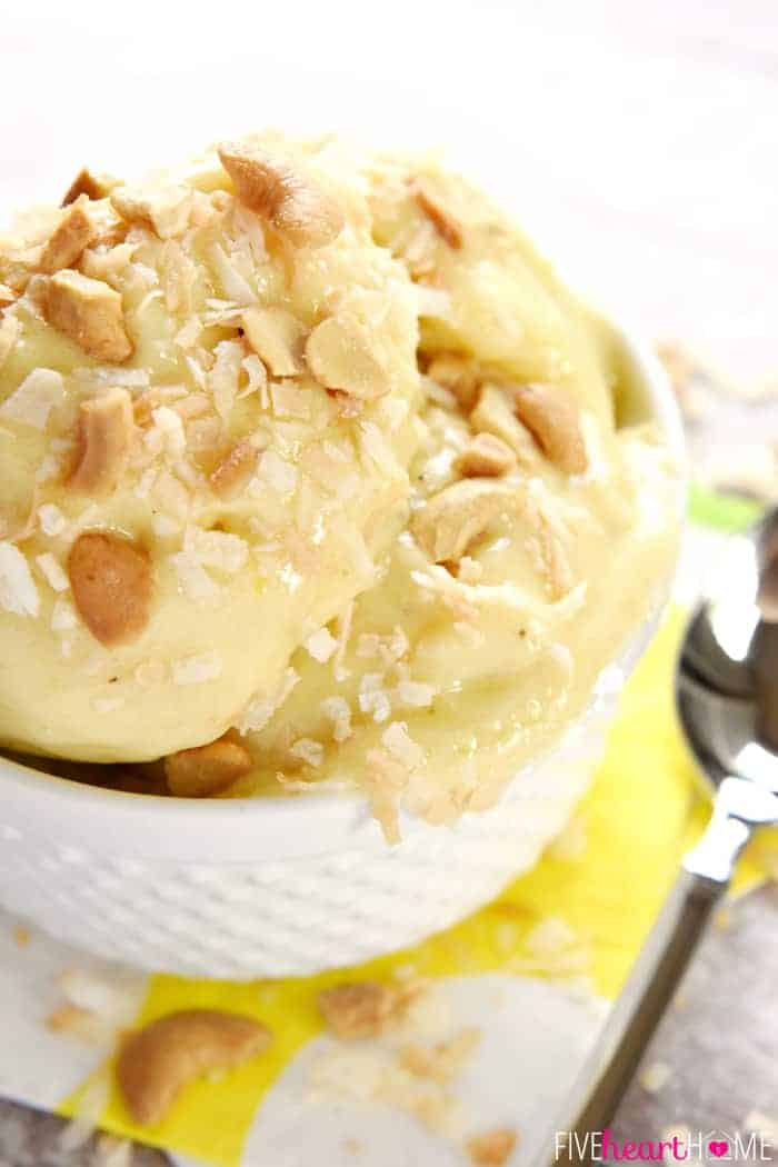 Aerial zoom of bowl of Banana Ice Cream garnished with nuts and coconut