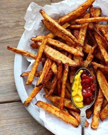 Baked Seasoned Fries ~ homemade French fries are coated with a delicious, spicy seasoning mix and then baked for a crispy, lightened-up side dish or snack! | LoveGrowsWild.com for FiveHeartHome.com