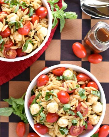 Caprese Orzo Salad ~ a vibrant summer pasta salad featuring juicy tomatoes, creamy balls of mozzarella, and ribbons of fresh basil, all topped off with a flavorful balsamic vinaigrette! | FiveHeartHome.com
