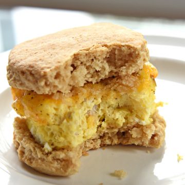 Freezer Breakfast Sandwich on a plate with big bite missing.