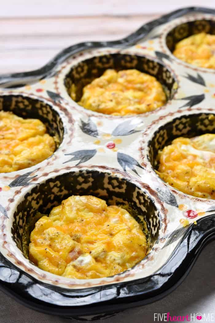 Easy Freezer Breakfast Sandwiches ~ cheesy scrambled eggs with ham are sandwiched inside of flaky biscuits in these make-ahead sandwiches that freeze beautifully...perfect for busy mornings and breakfast on-the-go! | FiveHeartHome.com Eggs cooked with ham and cheese to fill breakfast sandwiches.