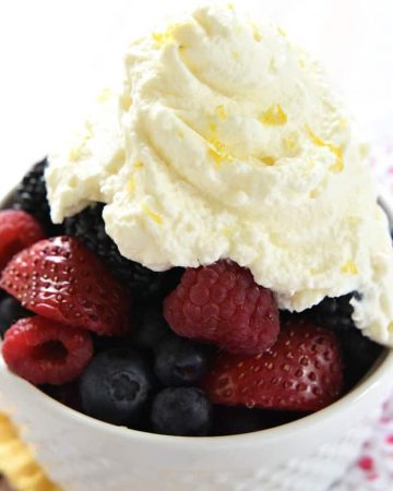 Lemon Whipped Cream ~ a light and citrusy topping for berries, waffles, pound cake, and more! | FiveHeartHome.com