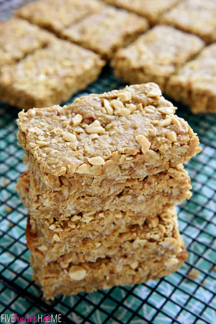 Peanut Butter Oatmeal Bars ~ loaded with wholesome oatmeal and whole wheat flour, flavored with peanut butter, and sweetened with honey, these soft-baked oatmeal bars make a yummy, on-the-go breakfast or snack! | FiveHeartHome.com Peanut Butter Oatmeal Bars stacked on wire rack.