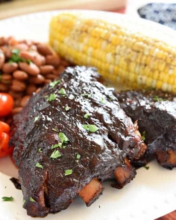 Slow Cooker Baby Back Ribs ~ sticky, smoky, and fall-apart delicious...nobody will ever believe that they came out of the crock pot! | FiveHeartHome.com