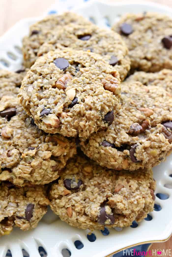 A pile of banana breakfast cookies on a white plate.