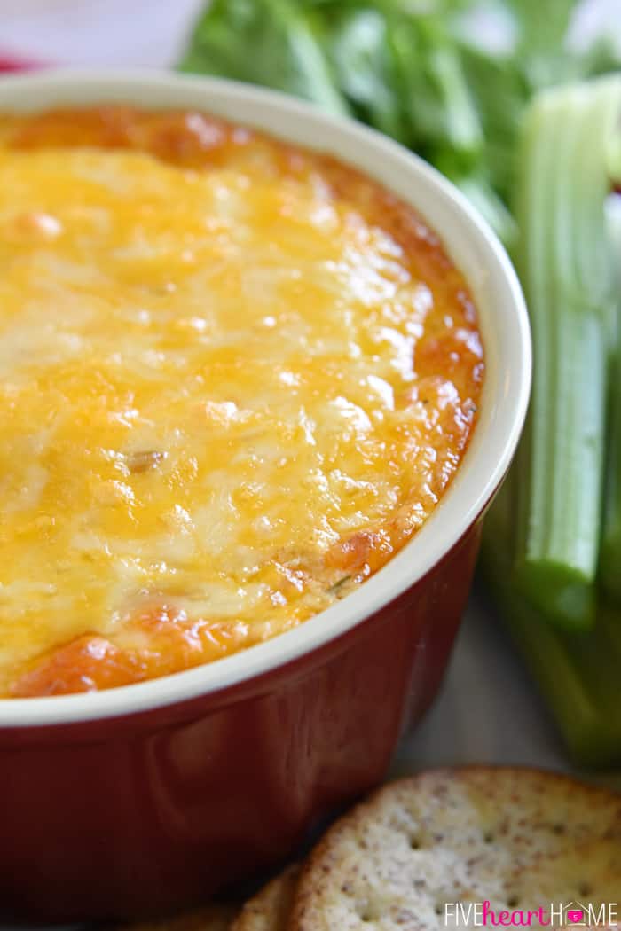Buffalo Wing Dip (AKA, Buffalo Chicken Dip) ~ warm, creamy, and loaded with cheese, chicken, and wing sauce, this decadent appetizer is perfect for parties or ideal for game day tailgating! | FiveHeartHome.com Close-up of melted cheese surface of Chicken Wing Dip.