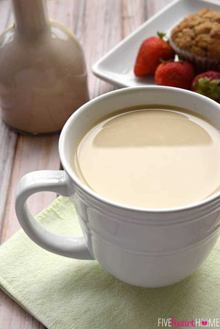 Jar of Almond Coffee Creamer and cup of coffee.