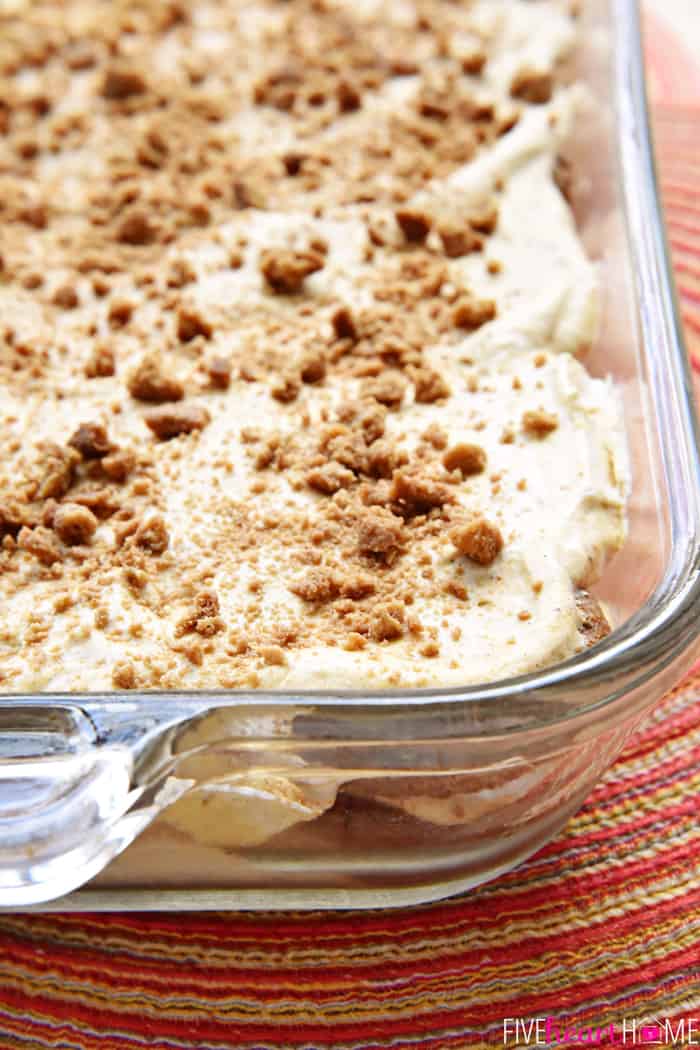 Pumpkin Icebox Cake with crushed gingersnaps sprinkled on top in pyrex dish