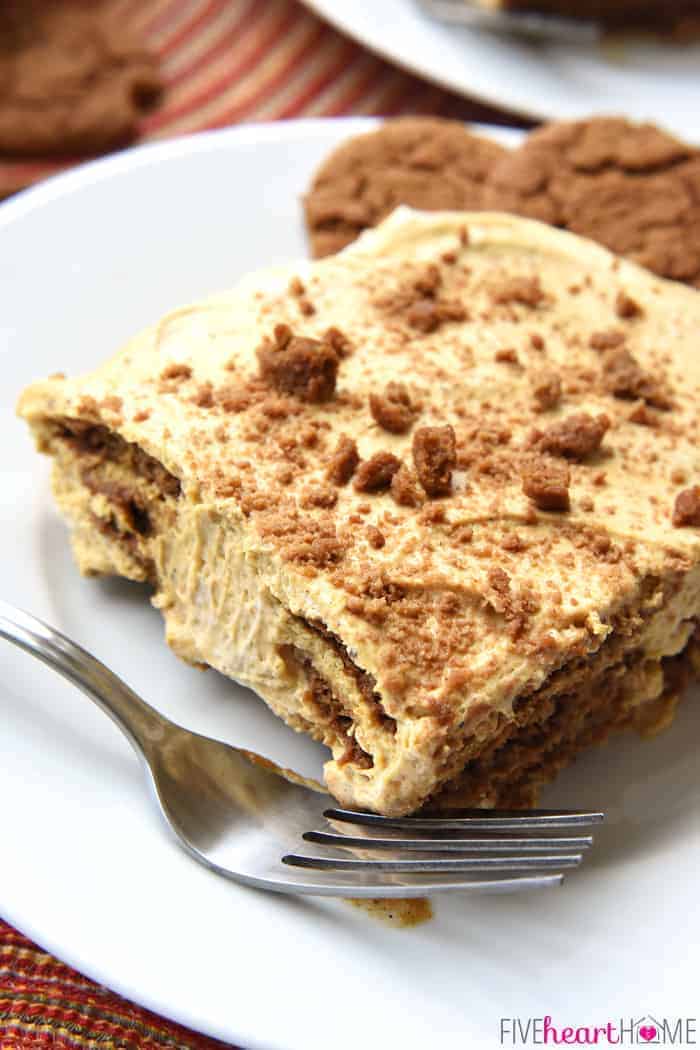 Slice of Pumpkin Icebox Cake on a plate with a fork and gingersnaps on the side