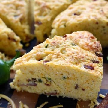 Jalapeรฑo Cheddar Cornbread close-up on wooden board.