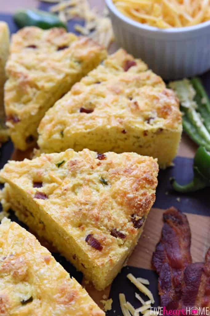Slices of Jalapeño Cheddar Cornbread with Bacon on board.