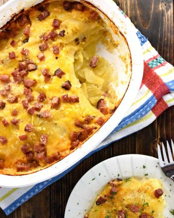 Cheesy Scalloped Potatoes with Ham ~ thin slices of potatoes drizzled with cream and layered with ham and cheddar for a decadent comfort food recipe that's also a great way to use up leftover holiday ham! | FiveHeartHome.com