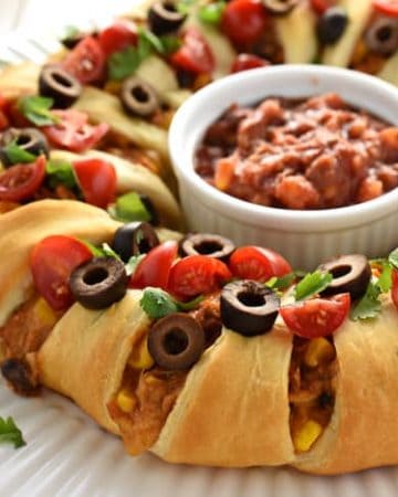 Chicken or Turkey Taco Crescent Ring ~ a delicious way to use up leftover chicken or holiday turkey...mixed with black beans, corn, and cream cheese, flavored with taco seasoning, and wrapped in light, flaky crescent roll dough for an easy yet impressive appetizer or dinner! | FiveHeartHome.com