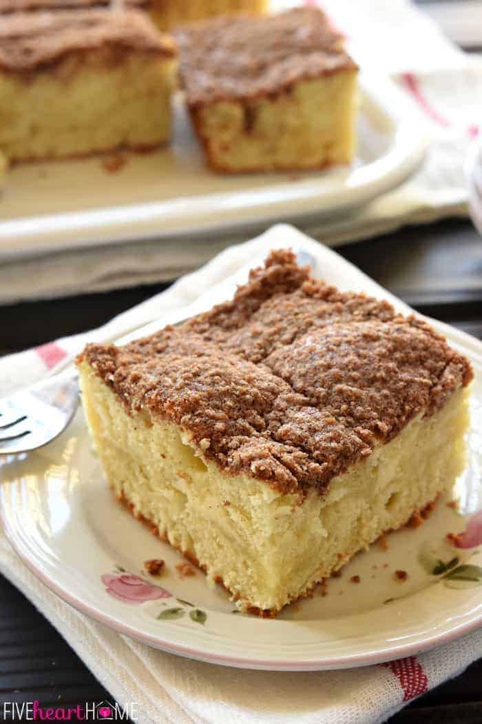 Slice of Cream Cheese Coffee Cake on a plate with platter in background