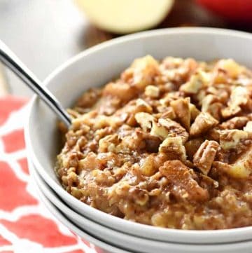 Apple Pie Overnight Steel Cut Oatmeal ~ loaded with steel cut oats and apple cinnamon goodness, this recipe is easy to throw in the slow cooker before bed for an effortless breakfast the next day. And with a special, no-stirring-required trick, you won't have to worry about burnt edges in the morning! | FiveHeartHome.com