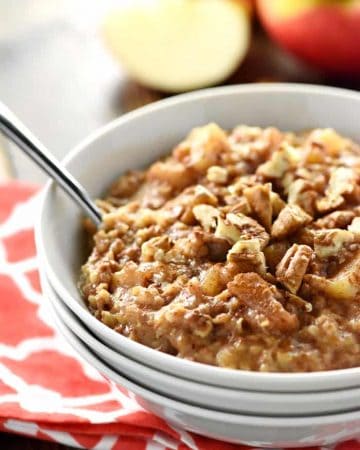 Apple Pie Overnight Steel Cut Oatmeal ~ loaded with steel cut oats and apple cinnamon goodness, this recipe is easy to throw in the slow cooker before bed for an effortless breakfast the next day. And with a special, no-stirring-required trick, you won't have to worry about burnt edges in the morning! | FiveHeartHome.com