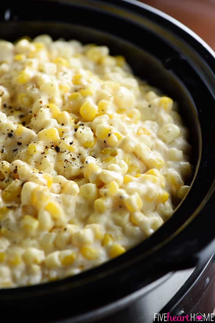 Slow Cooker Creamy Cheesy Corn ~ a rich, comforting side dish that's the perfect addition to any holiday menu...because not only is this recipe delicious, but it also frees up the stove and oven! | FiveHeartHome.com Slow Cooker Creamy Cheesy Corn Close-Up with Cracked Black Pepper