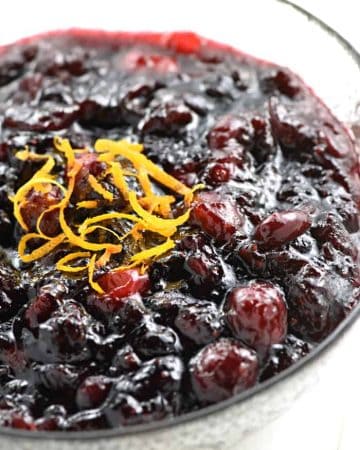 Cran-Cherry Sauce ~ sweetened with honey and brightened with citrus, this tasty twist on homemade cranberry sauce strikes a perfect balance between tart cranberries and luscious cherry preserves, making it the perfect addition to your Thanksgiving table! | FiveHeartHome.com