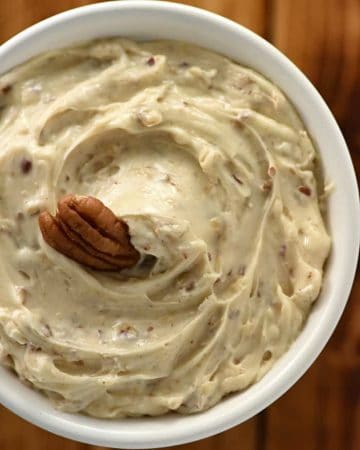 Pecan Praline Butter ~ a scrumptious twist on honey butter laced with cinnamon and vanilla and studded with toasted pecans, making it the perfect spread for dinner rolls, pancakes, waffles, sweet potatoes, and more! | FiveHeartHome.com