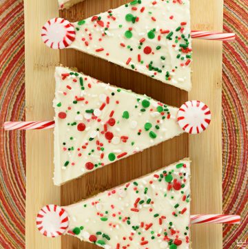 Christmas Tree Sheet Cake Pops lined up on board.
