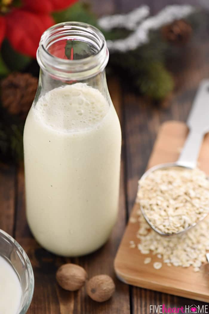 Frothy Eggnog, Oats and Nutmeg on a Wooden Surface 