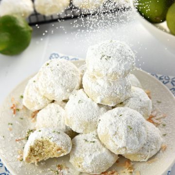 Lime Coconut Snowballs ~ tender shortbread-like cookies studded with lime zest & toasted coconut and generously rolled in powdered sugar for perfect year-round treats...from the lazy days of summer to a Christmas cookie platter! | FiveHeartHome.com