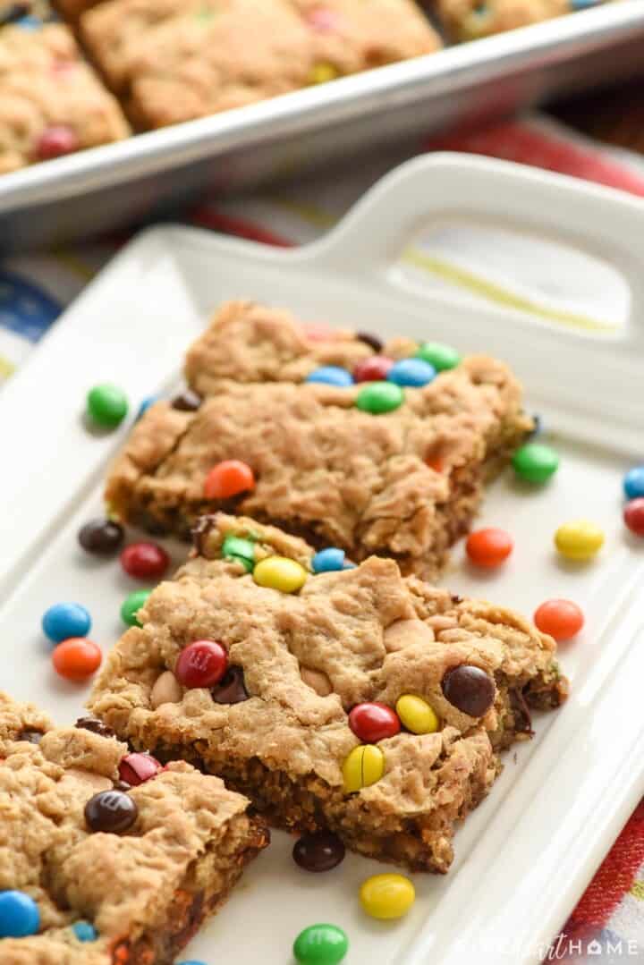 Monster Cookie Bars on platter and in pan.