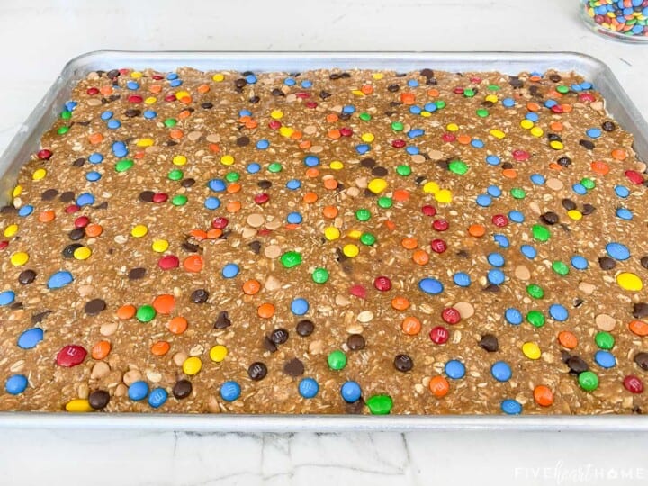 Monster Cookies dough pressed into sheet pan.