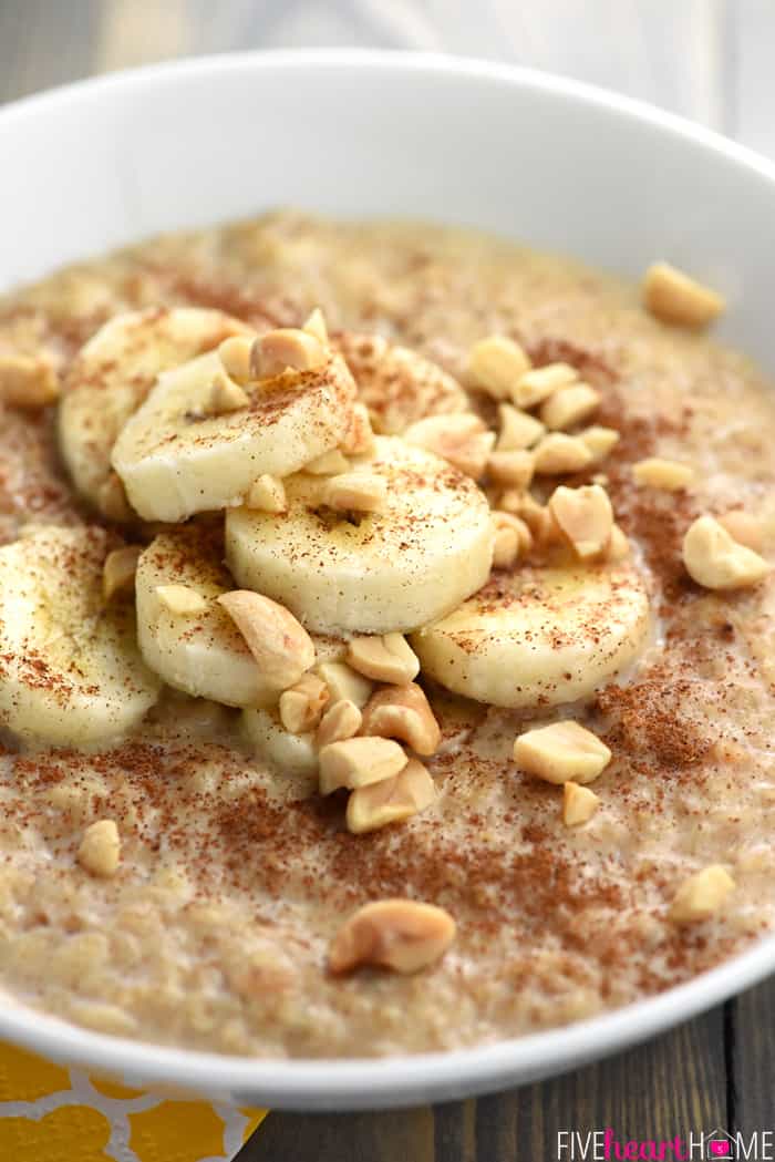 Honey, Cinnamon, Sliced Bananas and Peanuts on Top of a Bowl of Peanut Butter Banana Oatmeal 