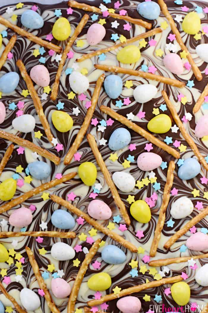 Aerial shot of Easter Bark with swirled chocolate, mini chocolate eggs, pretzels, and sprinkles