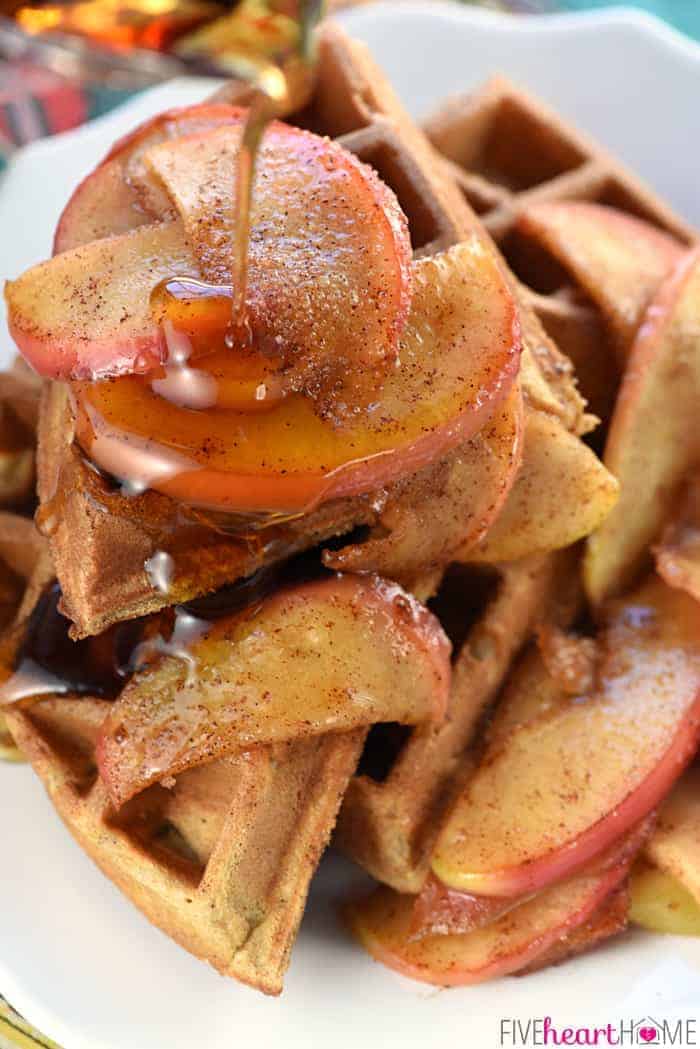 Apple Cinnamon Waffles with syrup being poured on top.