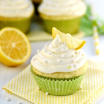 Lemon Cupcakes with Lemon Cream Cheese Frosting on table.