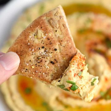 Roasted Garlic Hummus ~ mellow roasted garlic is blended with chickpeas, tahini, olive oil, and lemon juice for a fresh, creamy hummus that's delicious with homemade pita chips or crunchy veggie dippers! | FiveHeartHome.com