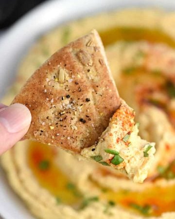Roasted Garlic Hummus ~ mellow roasted garlic is blended with chickpeas, tahini, olive oil, and lemon juice for a fresh, creamy hummus that's delicious with homemade pita chips or crunchy veggie dippers! | FiveHeartHome.com