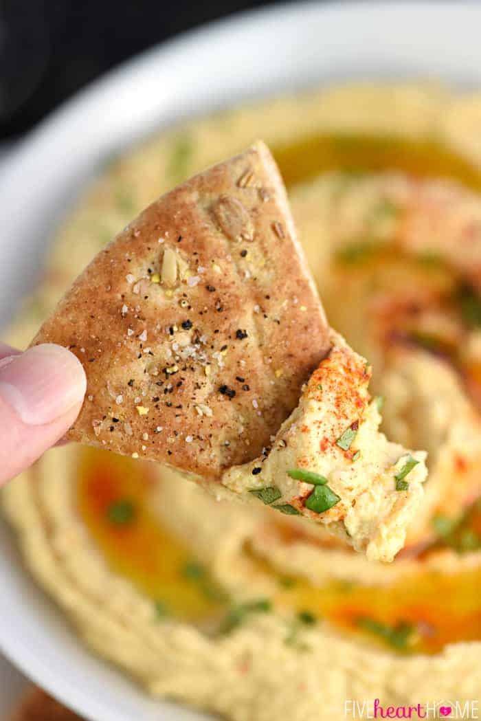 Roasted Garlic Hummus ~ mellow roasted garlic is blended with chickpeas, tahini, olive oil, and lemon juice for a fresh, creamy hummus that's delicious with homemade pita chips or crunchy veggie dippers! | FiveHeartHome.com