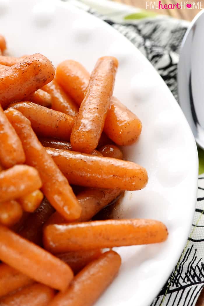 Close-up of crockpot carrots on a white plate.