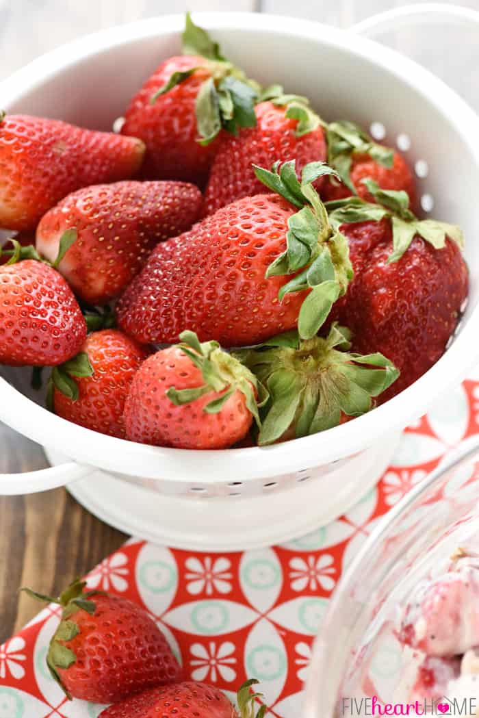 Colander of fresh red berries.