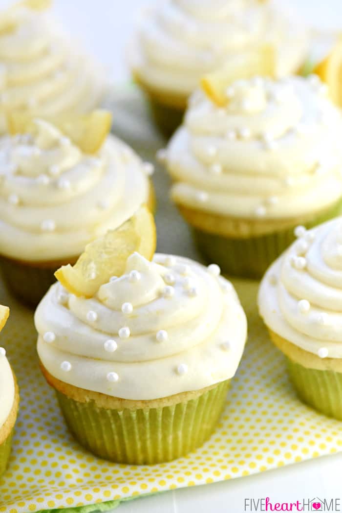 Lemon Cupcakes lined up on table.