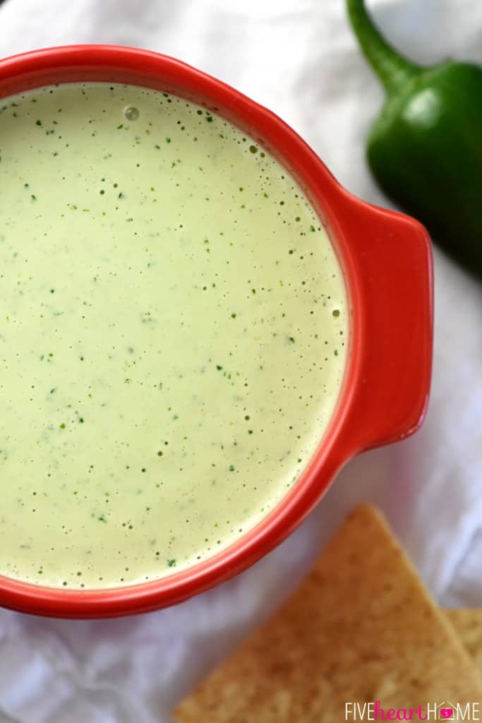 Aerial zoom of Creamy Jalapeño Dip in red bowl.