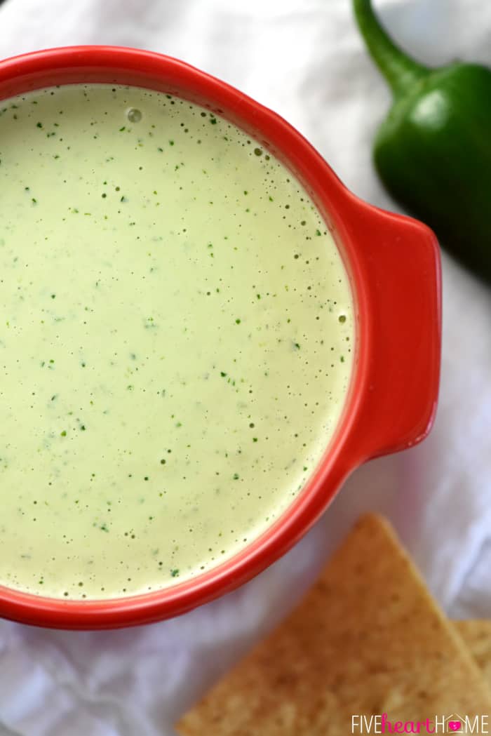 Aerial zoom of Creamy Jalapeño Dip in red bowl.