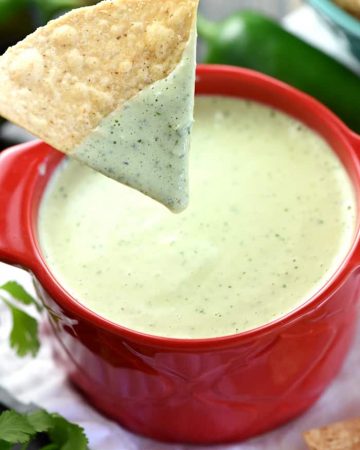 Creamy Jalapeño Dip ~ a base of homemade ranch dressing is flavored with fresh jalapeños, cilantro, and tomatillo salsa in this addictive copycat recipe of the popular appetizer at Chuy's! | FiveHeartHome.com