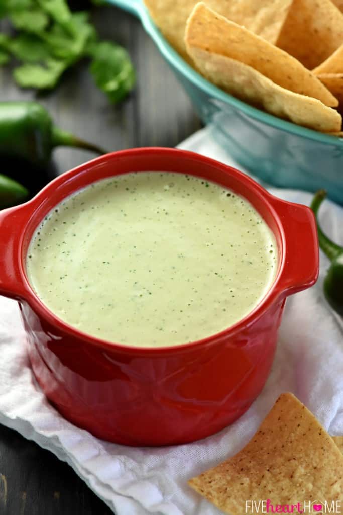 Creamy Jalapeño Dip in bowl with chips.