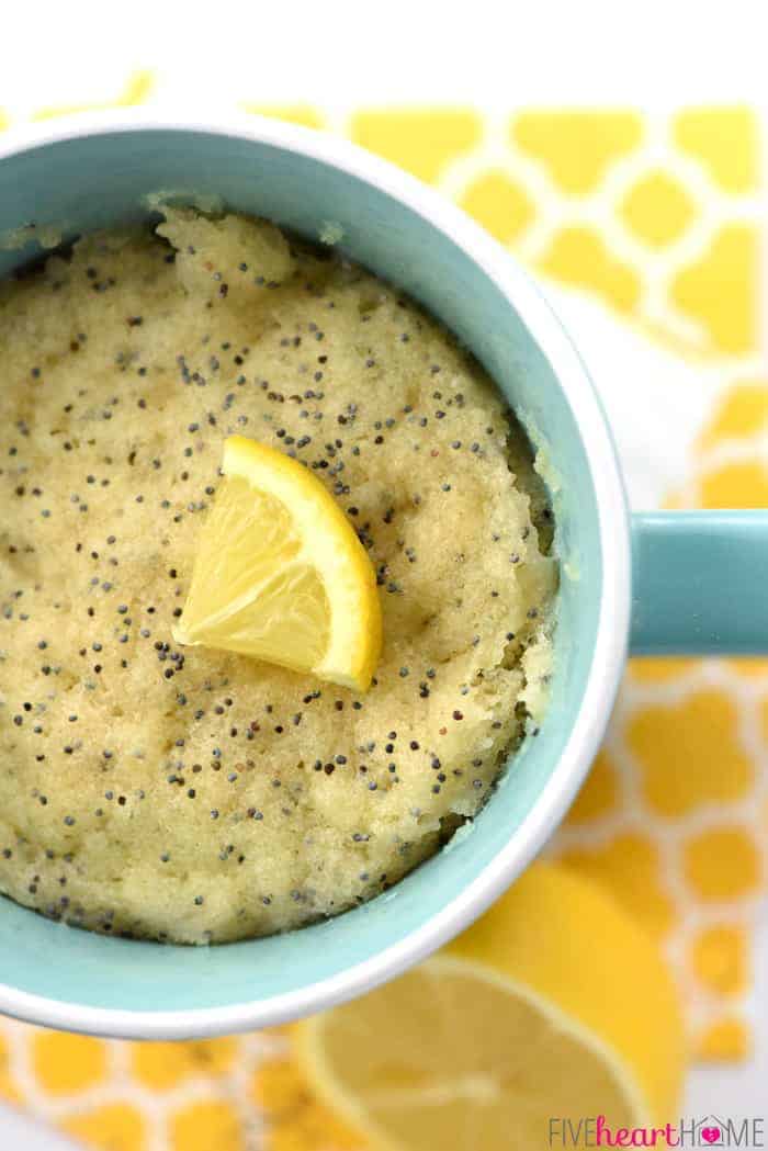 Aerial view of Lemon Mug Cake in a turquoise mug with small lemon wedge garnish