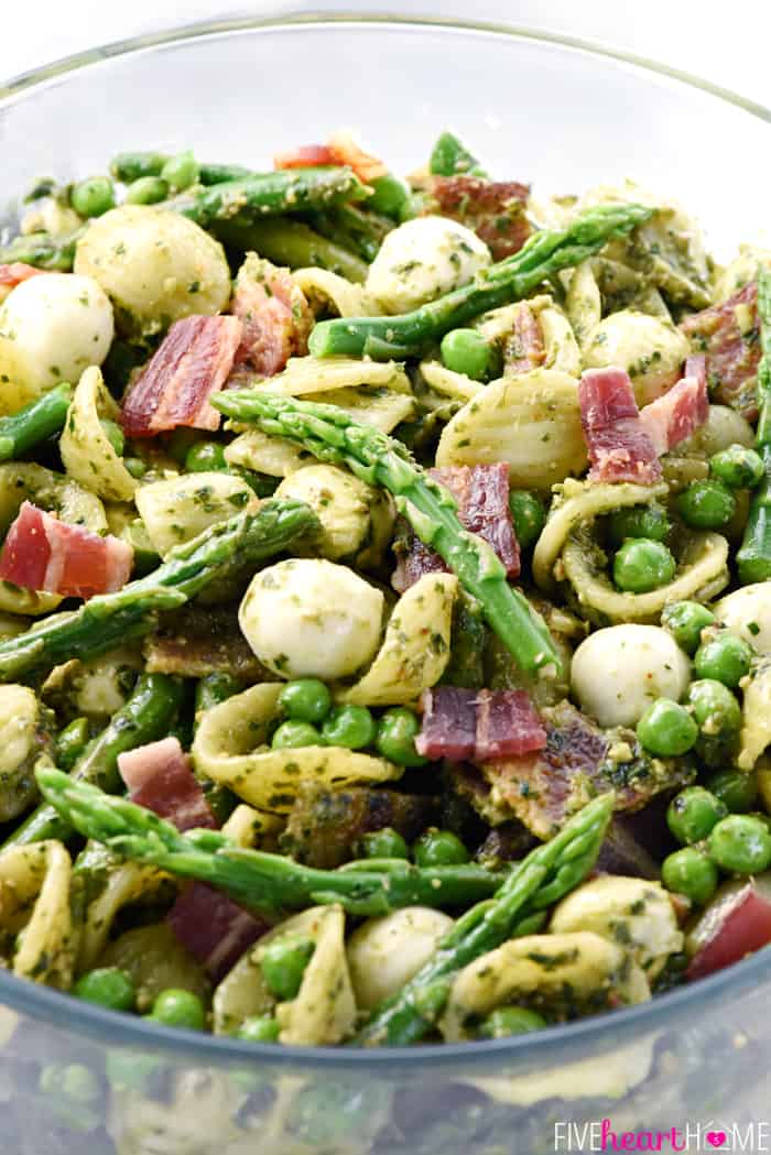 Pesto Pasta Salad in glass bowl.