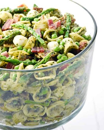 Pesto Pasta Salad in glass bowl.
