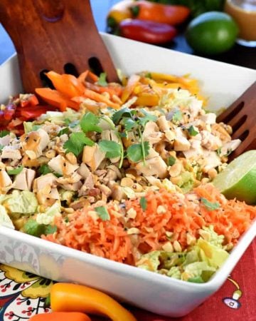 Thai Chicken Chopped Salad with Peanut Dressing ~ exploding with the contrasting flavors and textures of crunchy Napa cabbage, juicy chicken, colorful peppers, sweet carrots, salty peanuts, and fresh cilantro! | FiveHeartHome.com