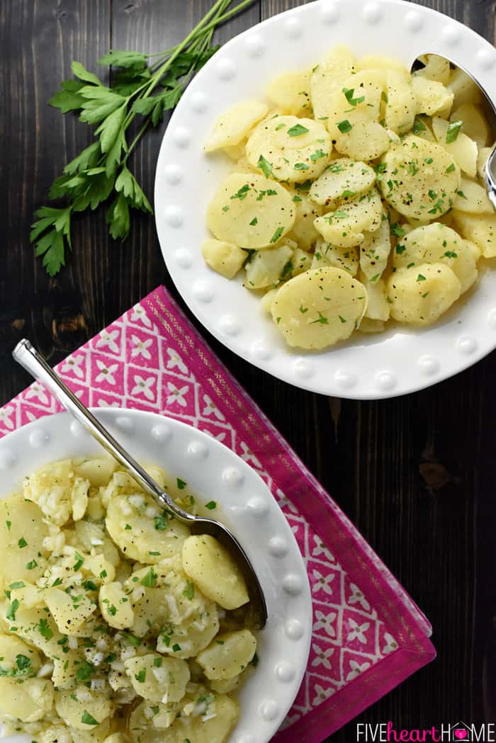 Areial view of two plates of Swabian Kartoffelsalat.