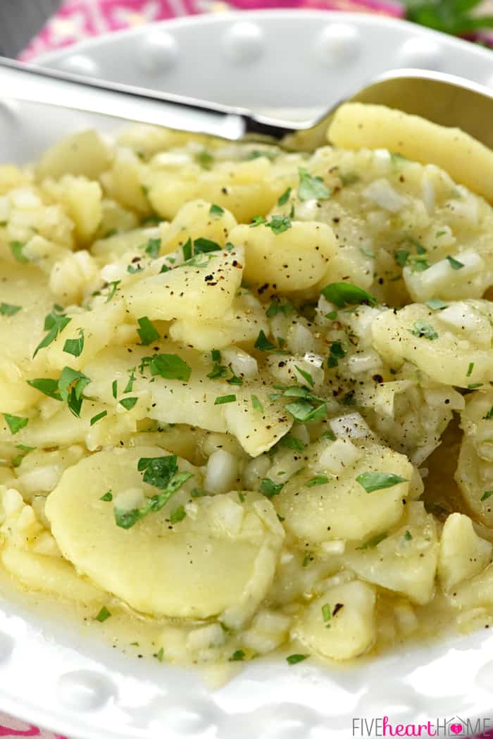 Bowl piled high with potato salad.